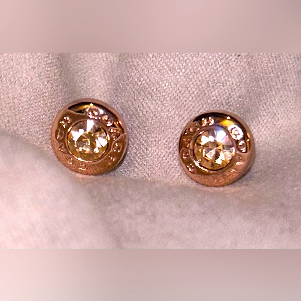 Rose gold Coach studs